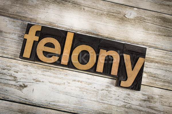 Felony Letterpress Word on Wooden Background Stock photo © enterlinedesign