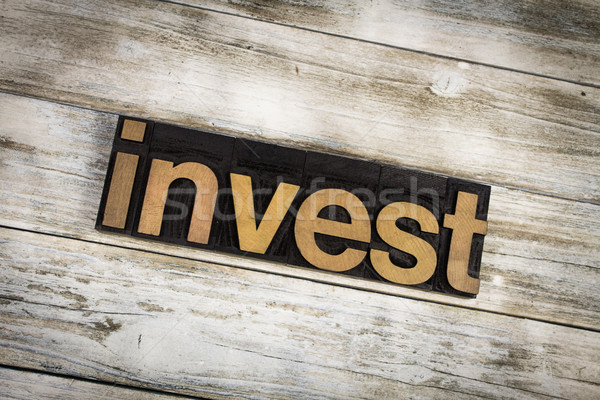 Invest Letterpress Word on Wooden Background Stock photo © enterlinedesign