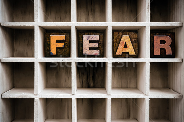 Fear Concept Wooden Letterpress Type in Draw Stock photo © enterlinedesign