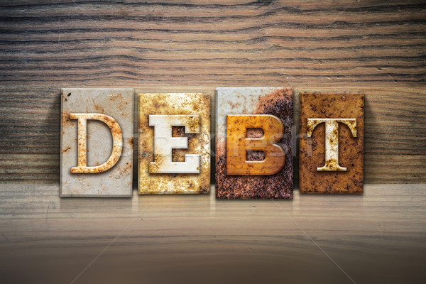 Adósság magasnyomás szó írott rozsdás fém Stock fotó © enterlinedesign