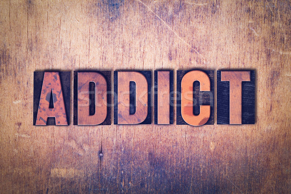 Addict Theme Letterpress Word on Wood Background Stock photo © enterlinedesign