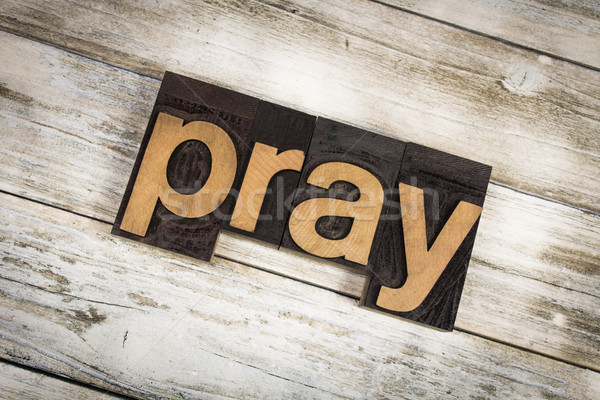 Pray Letterpress Word on Wooden Background Stock photo © enterlinedesign