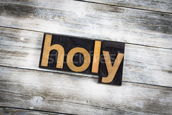 Holy Letterpress Word on Wooden Background Stock photo © enterlinedesign