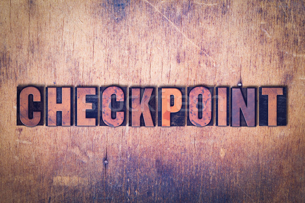 Checkpoint Theme Letterpress Word on Wood Background Stock photo © enterlinedesign