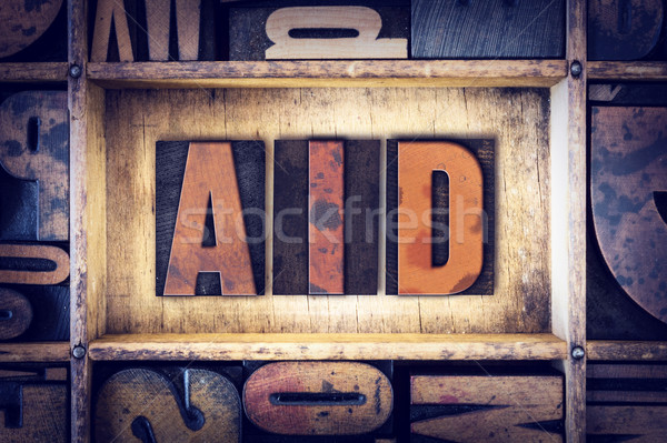 Aid Concept Letterpress Type Stock photo © enterlinedesign