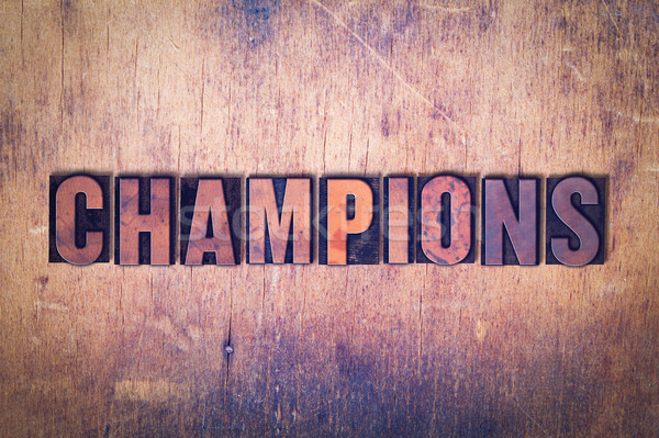 Champions Theme Letterpress Word on Wood Background Stock photo © enterlinedesign