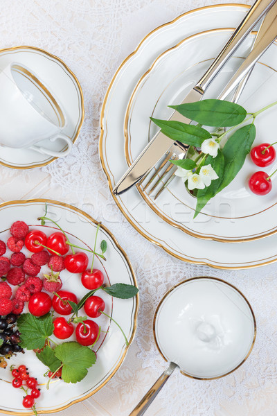 Beautiful table setting  with different berries Stock photo © Epitavi