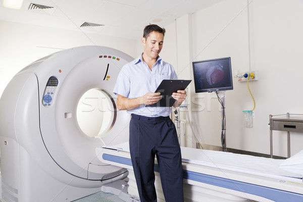 Stock photo: MRI scanner and doctor