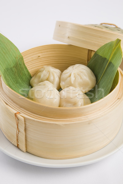 dumplings in bamboo steamer Stock photo © epstock
