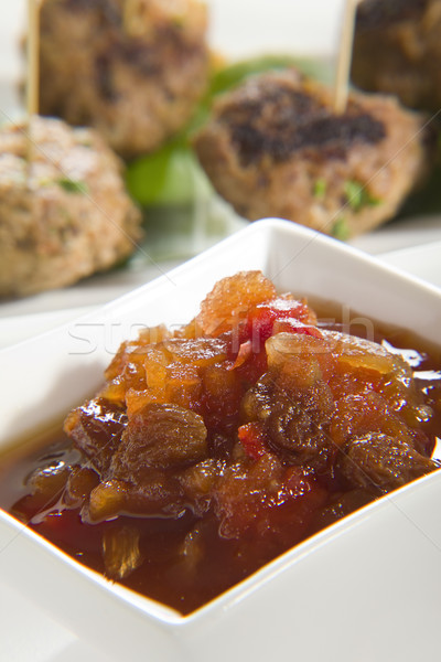 Chutney with meatballs in background Stock photo © epstock