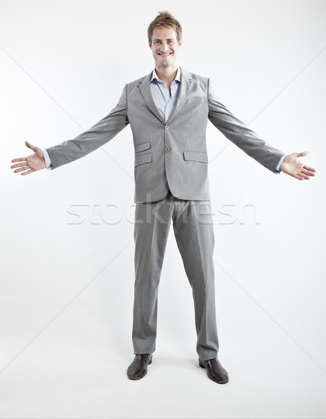 business man in grey suit on white background in studio Stock photo © epstock
