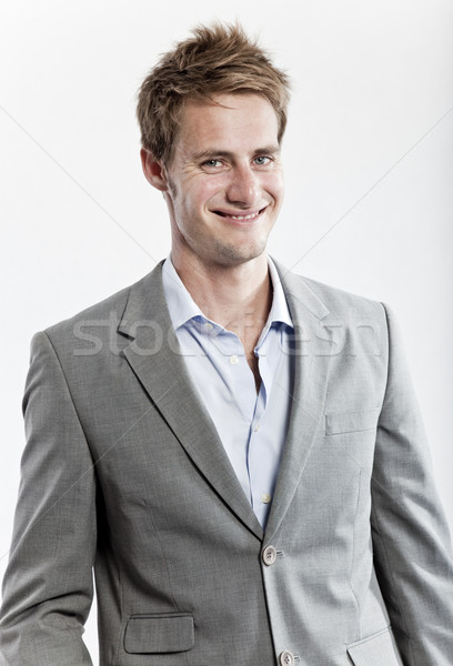 business man in grey suit on white background in studio Stock photo © epstock