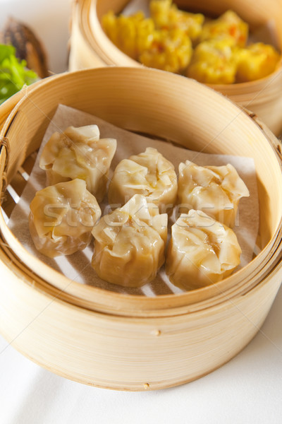 Dumplings in bamboo steamer Stock photo © epstock