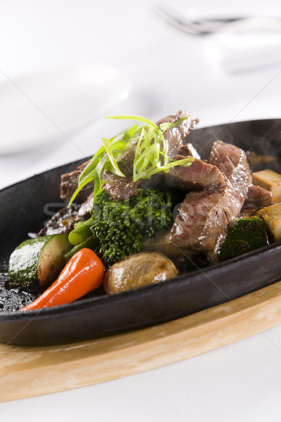 Honey & Pepper Sizzling Beef and vegetables Stock photo © epstock