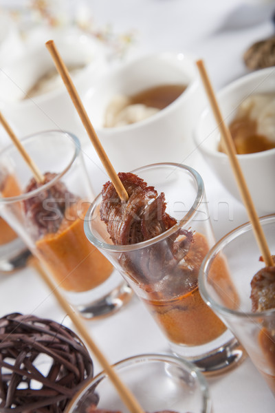 Asian Fusion lamb on stick in shot glass with sauce Stock photo © epstock