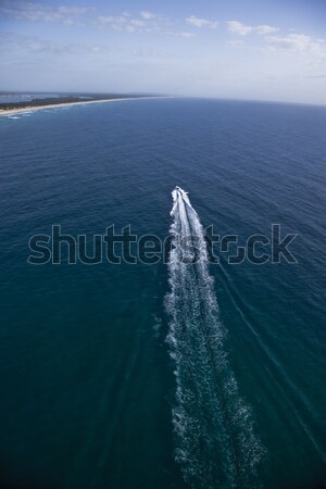 Small motor boat sailing towards an island Stock photo © epstock