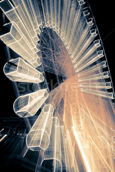 Riesenrad Bewegung glühend Nachthimmel Rad beleuchtet Stock foto © epstock