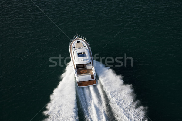 Elegant yacht sailing though deep waters Stock photo © epstock