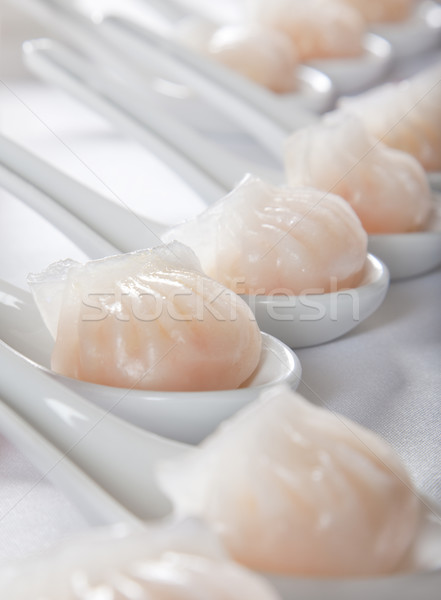dumplings served on white spoons Stock photo © epstock