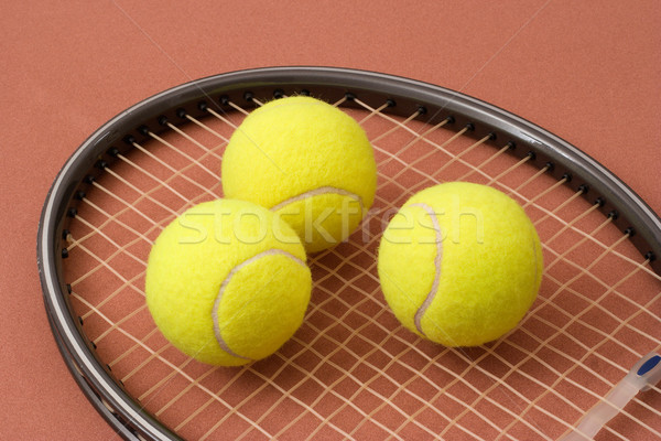 Stock photo: Tennis balls and racket