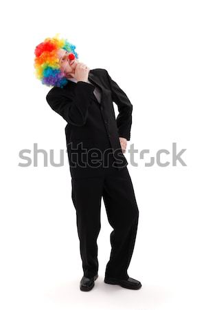 Homme d'affaires coloré clown perruque pense Photo stock © erierika