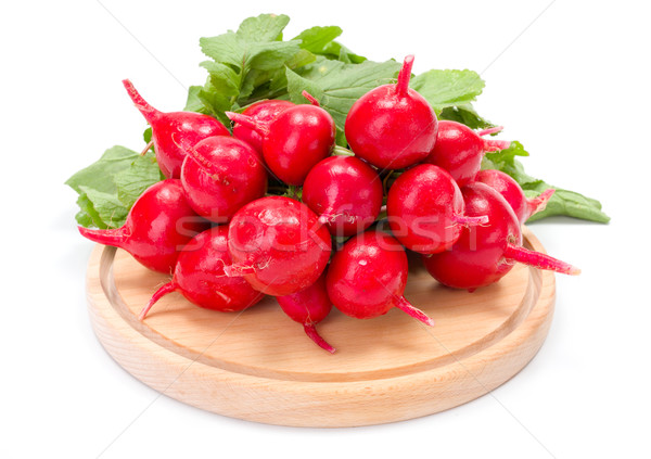 Fresh red radish on wooden cutting board Stock photo © erierika