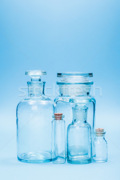 Clear empty glass reagent bottles Stock photo © erierika