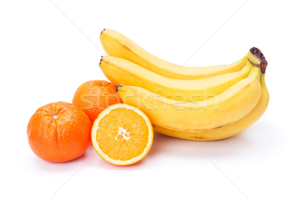 Stock photo: Bunch of ripe bananas and oranges