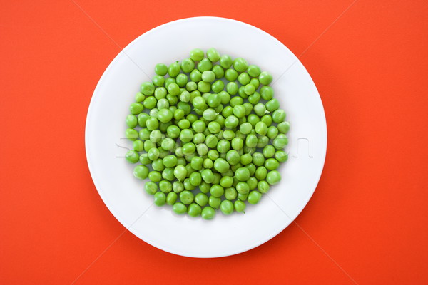 Green peas in plate Stock photo © erierika
