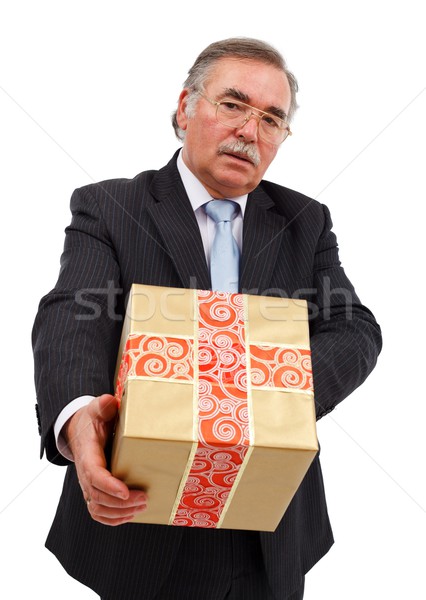 Stock photo: Senior man offering gift