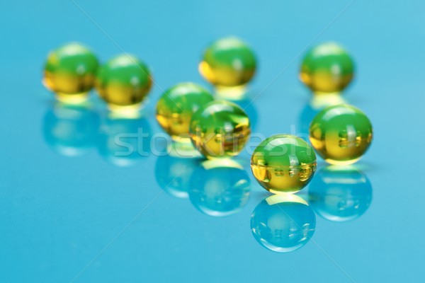 Macro of E vitamines on blue Stock photo © erierika