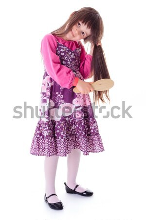Little girl combing her frizzy hair Stock photo © erierika