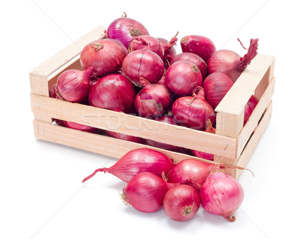 Red onions in wooden crate Stock photo © erierika