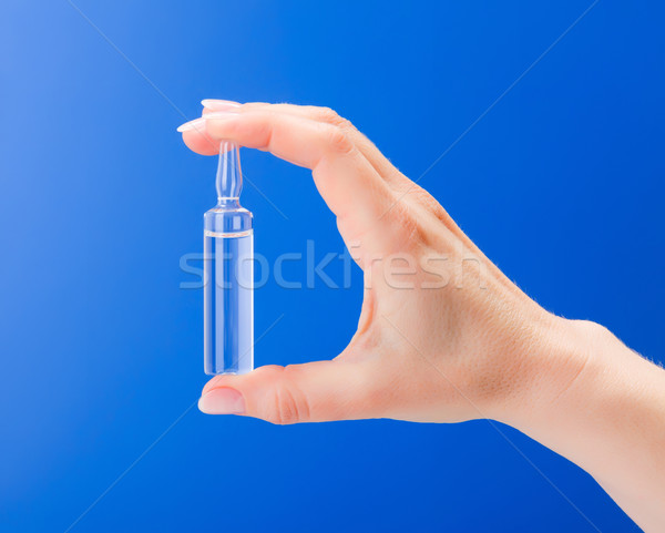 Kéz tart üveg háttér gyógyszer labor Stock fotó © erierika
