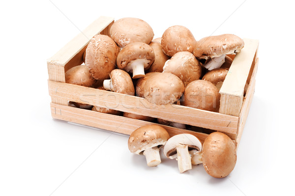 Cultivated brown mushrooms in wooden crate Stock photo © erierika