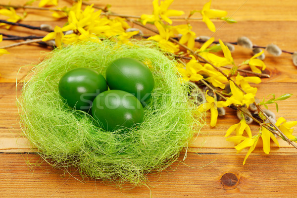 Green eggs in nest Stock photo © erierika