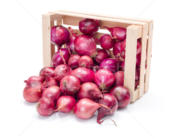 Red onion bulbs in wooden crate Stock photo © erierika