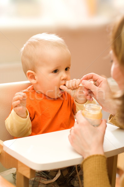 Feeding a little baby boy Stock photo © erierika