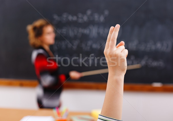 Raised arm in math class Stock photo © erierika