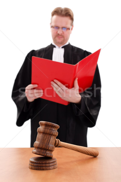 Justice gavel in front, judge reading in back Stock photo © erierika