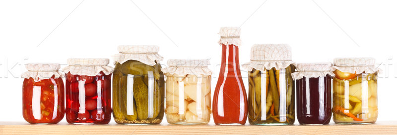 Stock photo: Various preserves on a wooden shelf 