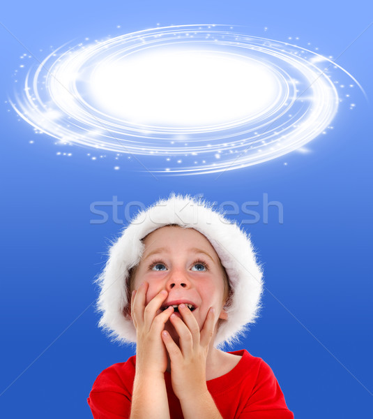 Surprised boy looking up to object placeholder Stock photo © erierika