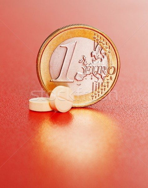 Dois pílulas um euro moeda branco Foto stock © erierika