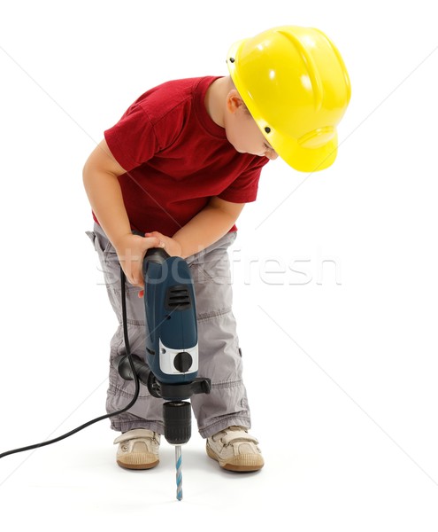 Little boy drilling in ground, wearing protective helmet Stock photo © erierika