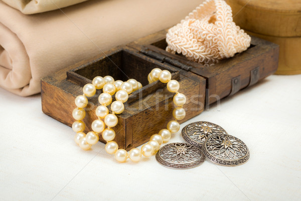 Vintage lace, silver buttons and pearl necklace Stock photo © erierika