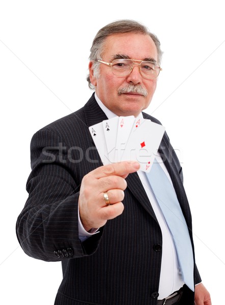 Stock photo: Senior man showing the four aces