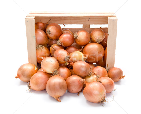 Yellow onions in wooden crate Stock photo © erierika