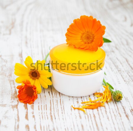 Face cream and calendula flowers Stock photo © Es75