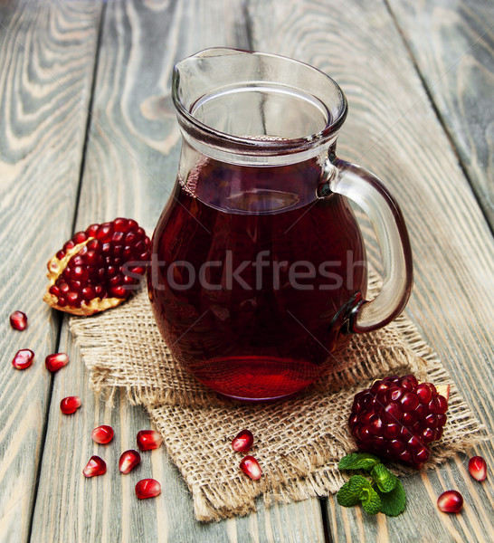 Pitcher of pomegranate juice Stock photo © Es75