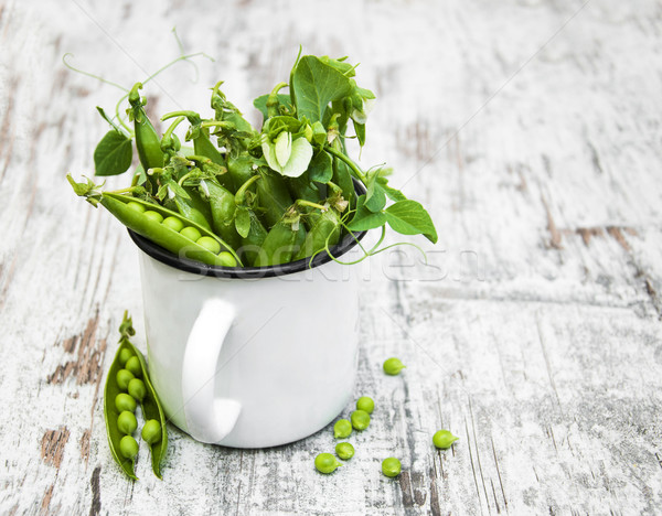 Metal cup with fresh peas Stock photo © Es75